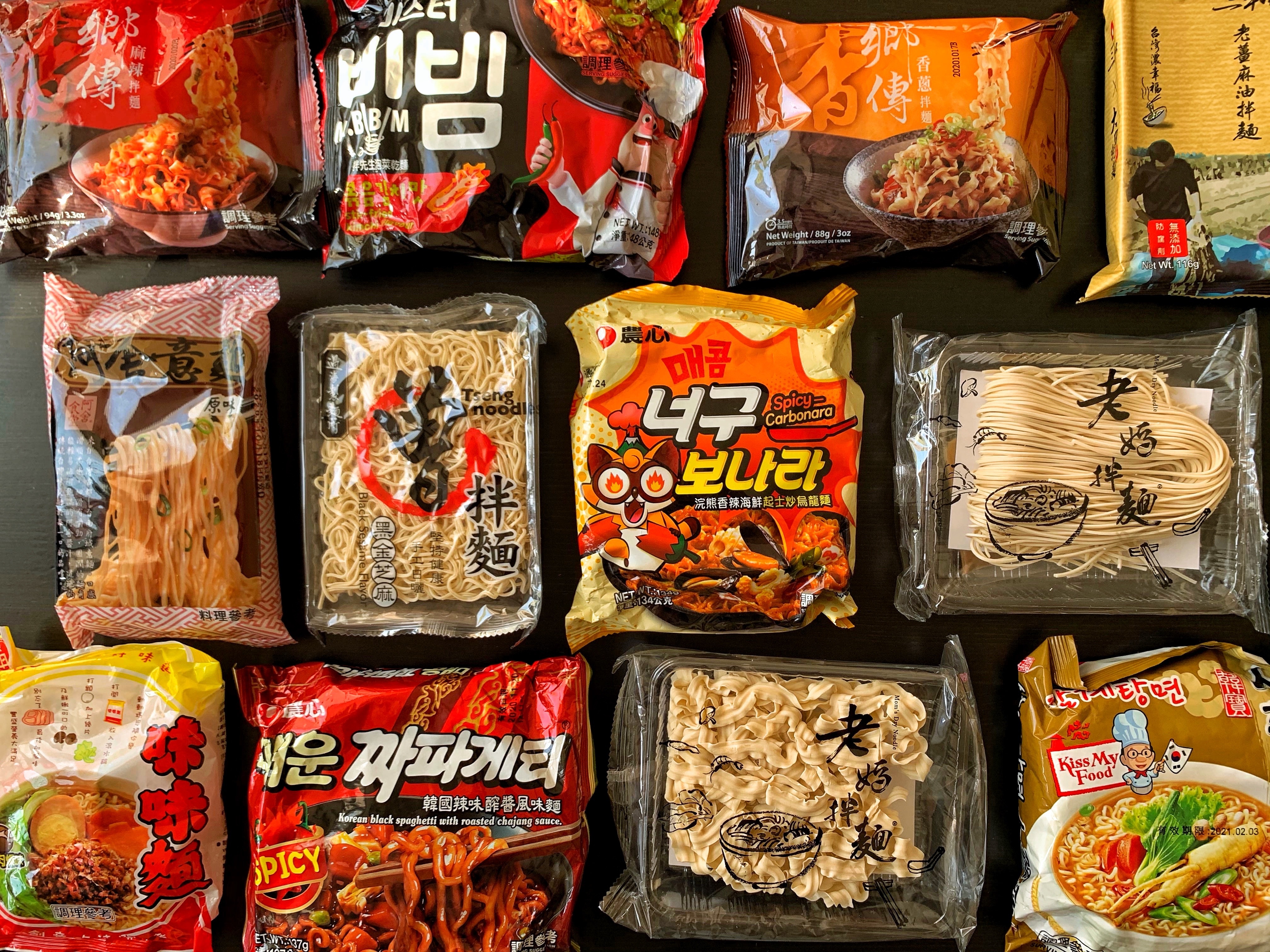 Multiple colorful packets of instant noodles.