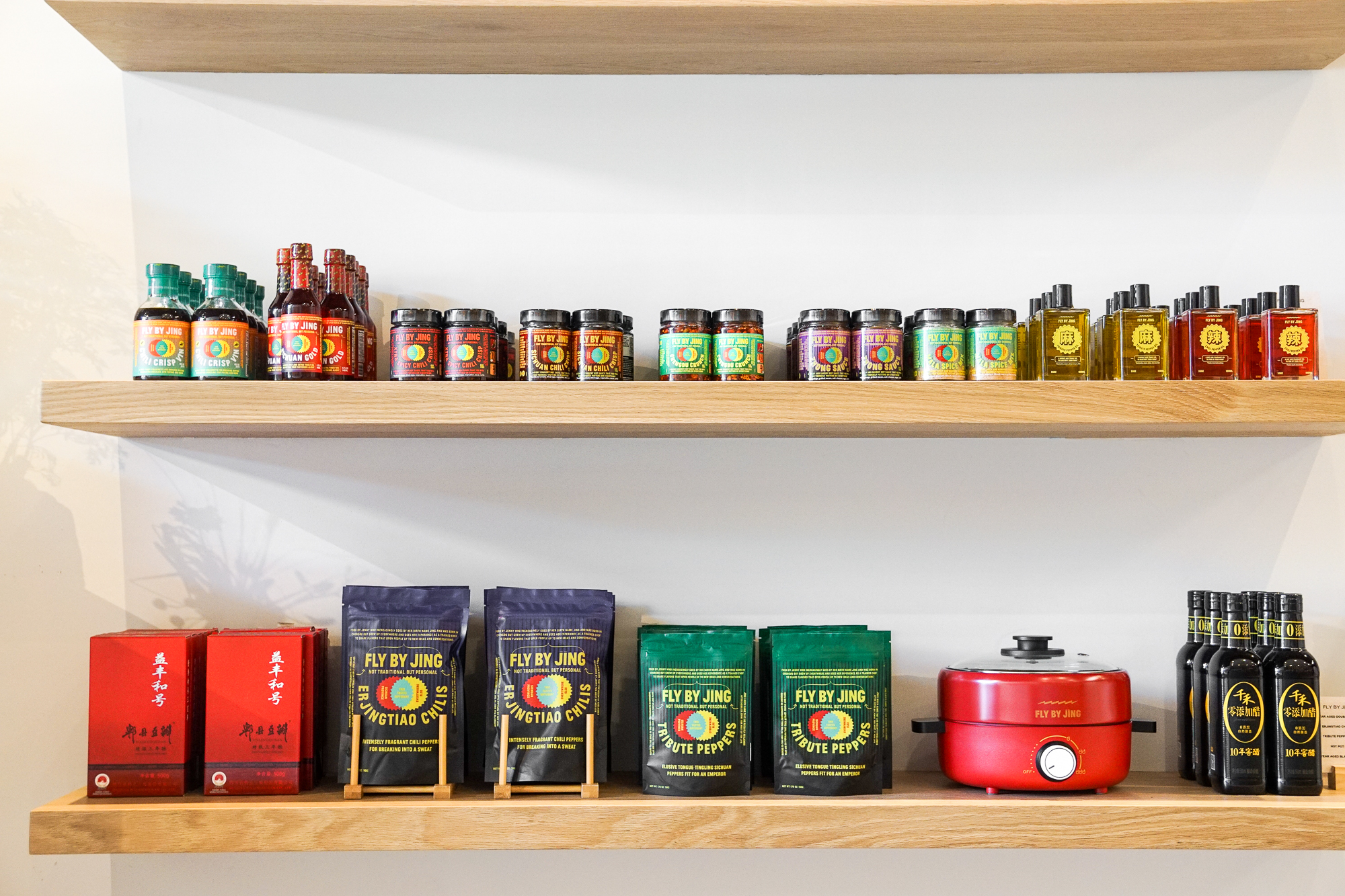 Fly by Jing chile oils, sauces, and dried chiles at Suá.